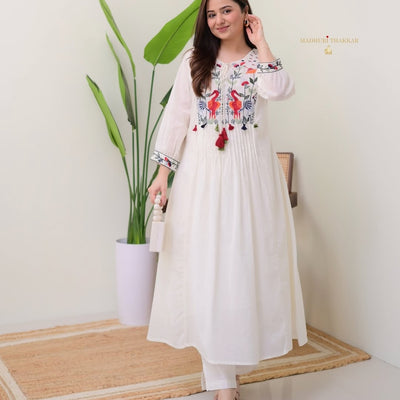 2 pc suit set with pintex on kurti with embroidery detailing on yoke and sleeves..
